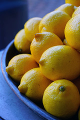 Fresh ripe yellow lemons at the market