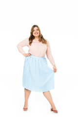 Fototapeta premium happy elegant overweight woman holding skirt isolated on white