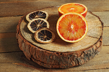 Juicy reddish tangerine on wood