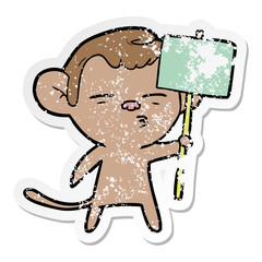 distressed sticker of a cartoon suspicious monkey with signpost