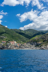 Naklejka na ściany i meble Italy, Cinque Terre, Monterosso, a large body of water with a mountain in the background