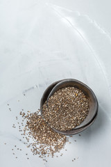 Organic healthy chia seeds in a bowl, vegan superfood concept