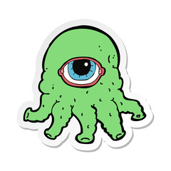 sticker of a cartoon alien head