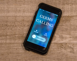 Cell Phone showing call from, Germs Calling