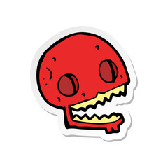 sticker of a cartoon spooky skull