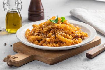 Pasta Bolognese. Fusilli with minced meat and grated cheese