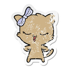 distressed sticker of a cartoon cat with bow on head