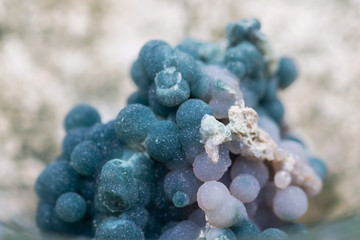 Fototapeta premium Grape Agate Clusters from Indonesia in Moss Agate hand carved polished bowl from Morocco. Botryoidal Purple Chalcedony.