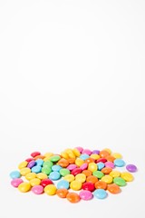 Pile of colorful sweets candies - side view.