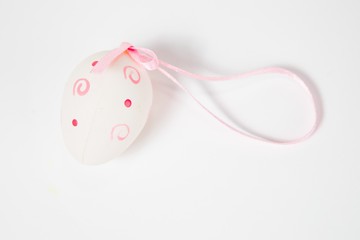 Ornate eggshell with ribbon - hand made easter decoration.