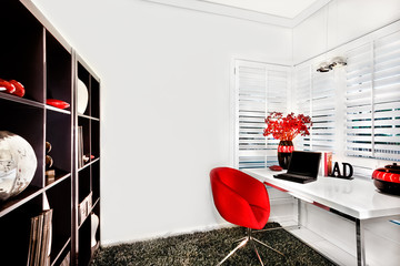 Modern workroom in a luxurious house with a small white table and a red chair