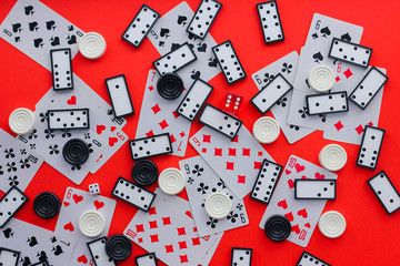 top view of Board games: dominoes, playing cards, checkers.