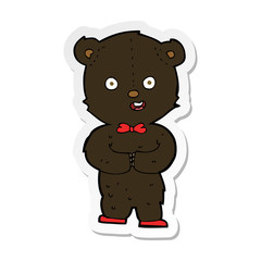 sticker of a cartoon teddy black bear