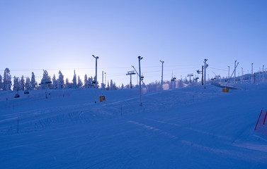 Kuusamo / Finland: View over the slopes and lifts in Ruka Valley on a beautiful day in February