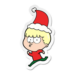 sticker cartoon of a curious boy running wearing santa hat