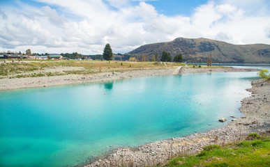 Beautiful view of turquoise water of lake Tekapo in New Zealand one of the most tourist attraction...
