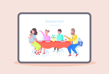 parents with children sitting cafe table enjoying the food people visitors having dinner and talking at family restaurant copy space full length flat horizontal