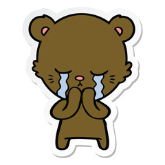 sticker of a crying cartoon bear