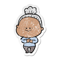 distressed sticker of a cartoon happy old woman