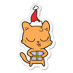 cute sticker cartoon of a cat wearing santa hat