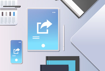 cloud data share online internet sharing network top angle view workplace desktop with tablet pc and smartphone screen synchronization storage office stuff horizontal