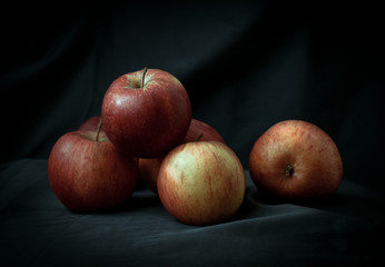 organic red apples on the dark background