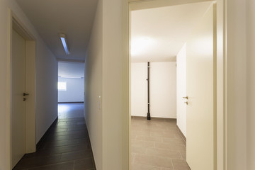 Cellar with gray tiles and white walls