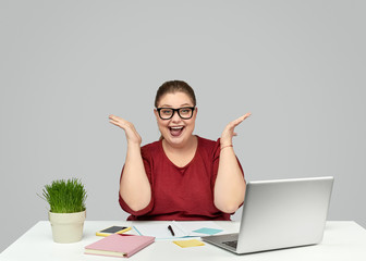 Excited office worker looking at camera