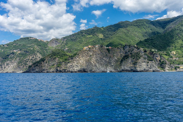 Obraz premium Italy, Cinque Terre, Monterosso, a large body of water with a mountain in the background