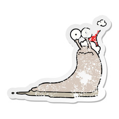 distressed sticker cartoon of a slug wearing santa hat