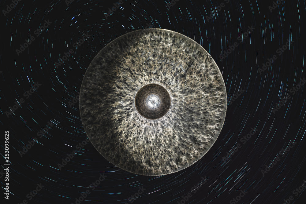 Wall mural drum cymbal in the form of a planet among the vastness of the space