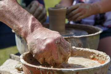Production of a clay pot on a Potter's wheel.