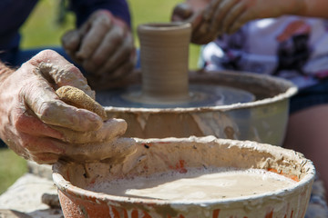 Production of a clay pot on a Potter's wheel.