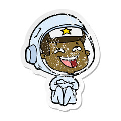 distressed sticker of a cartoon laughing astronaut