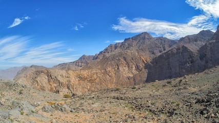 Fototapeta na wymiar Fantastic mountain landscape. Ru'us al Jibal. Al Hajar Moutains. Musandam. Oman