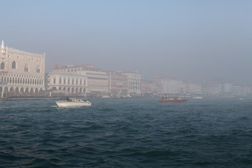 Fototapeta premium Quay of San Marco and the lagoon in the fog of Venice