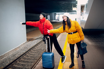 Young female stops railway train.