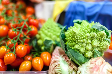 Fresh tomatoes of different varieties at the farmers market