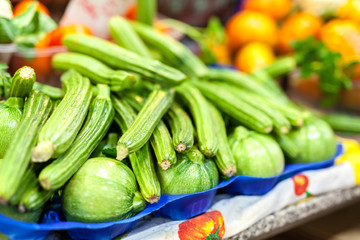 Zucchini flower blossoms in a crate at an Italian farmers market
