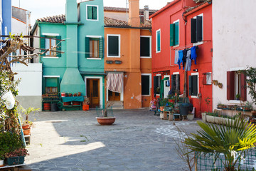 Fototapeta na wymiar colorful houses alongside the canal in Burano island