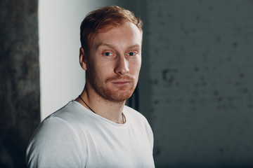 Young male portrait in white shirt