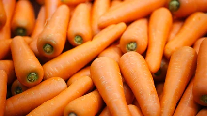 Fotobehang Beautiful ripe carrot background.Carrots in the supermarket. © nukies1234