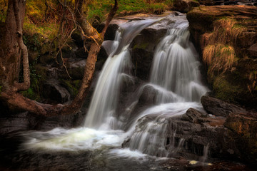 Fototapeta na wymiar Cascading water at Blaen y Glyn One of a series of closely connected waterfalls at Blaen y Glyn, near Merthyr Tydfil in the South Wales valleys, UK