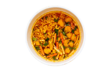 Hot and spicy instant noodle cup ready to eat on the wooden table close up.  Isolated object on white background.