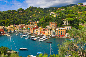 Portofino is a resort town in the Italian Riviera.  This is a popular tourism destination for travel in northwestern Liguria Italy.  An aerial view looking down on this romantic destination.