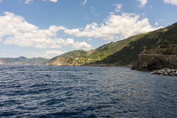 Obraz premium Italy, Cinque Terre, Monterosso, a large body of water with a mountain in the background