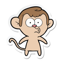 sticker of a cartoon hooting monkey
