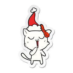 sticker cartoon of a cat wearing santa hat