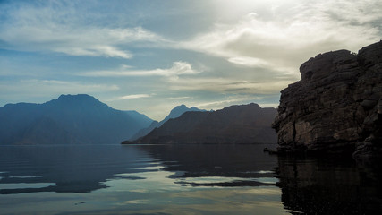 Beautiful mountains reflected in the water. Fjords on the Musandam peninsula. Khasab. Oman