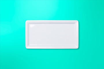 Empty white plate on teal gradient background